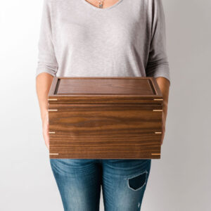 walnut keepsake box held in hands for scale
