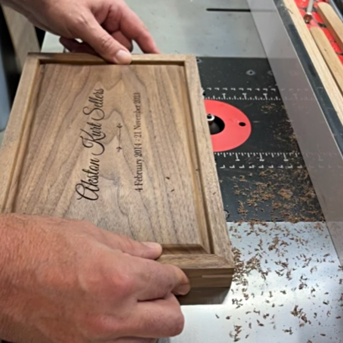 Creating beveled edges on a hardwood box lid using a router