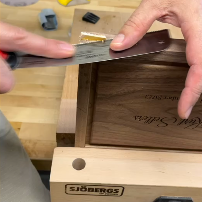 Close-up of corner spline joinery on a mitered walnut keepsake box
