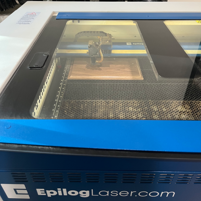 Laser engraving a custom design onto the lid of a keepsake box