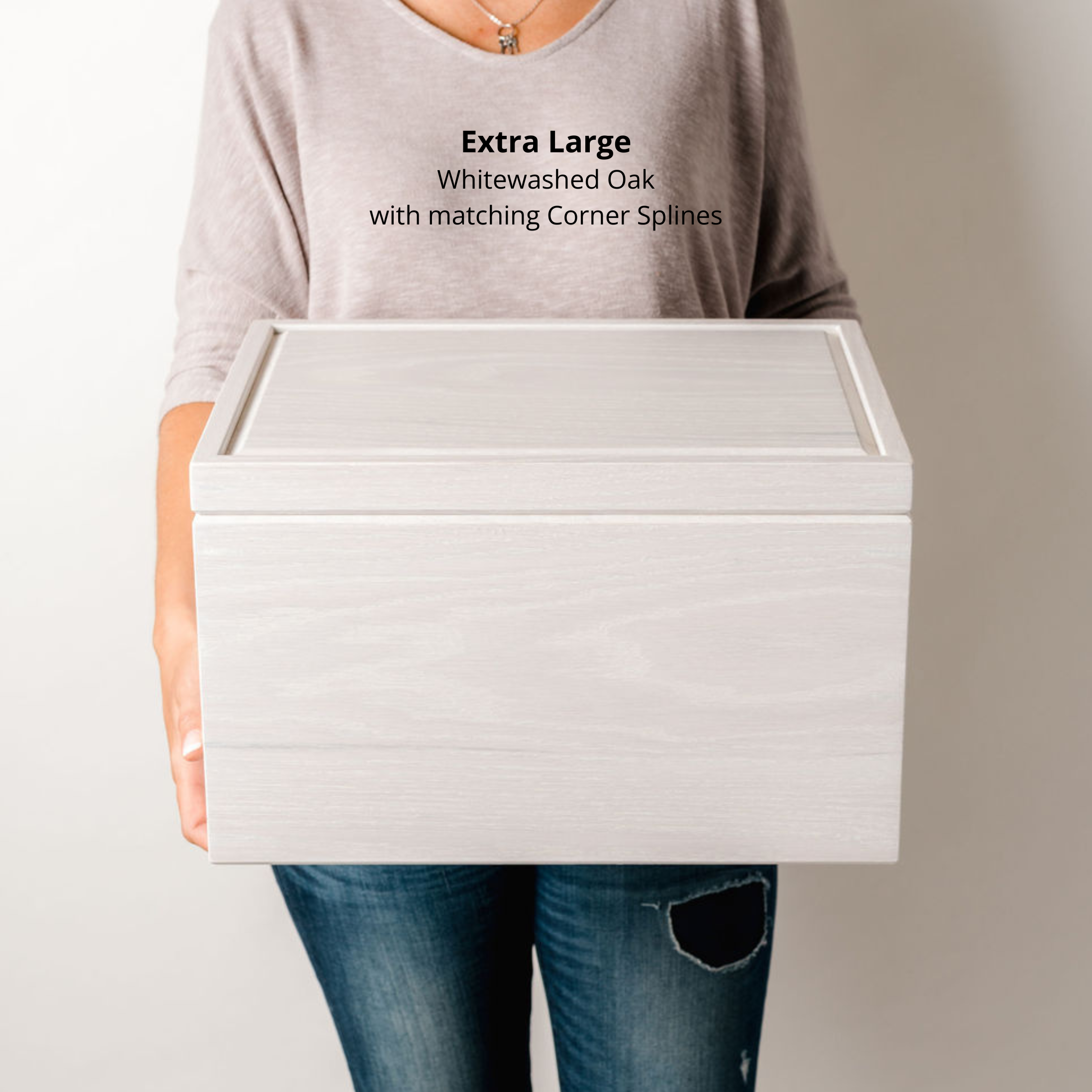 Woman holding an extra large whitewashed white oak keepsake box to show size and scale